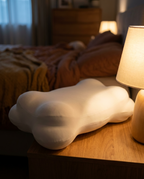 Velmesta Cloud Alignment Pillow on nightstand at dusk