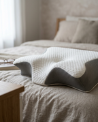 Velmesta Wave Contour Pillow on a made bed close-up