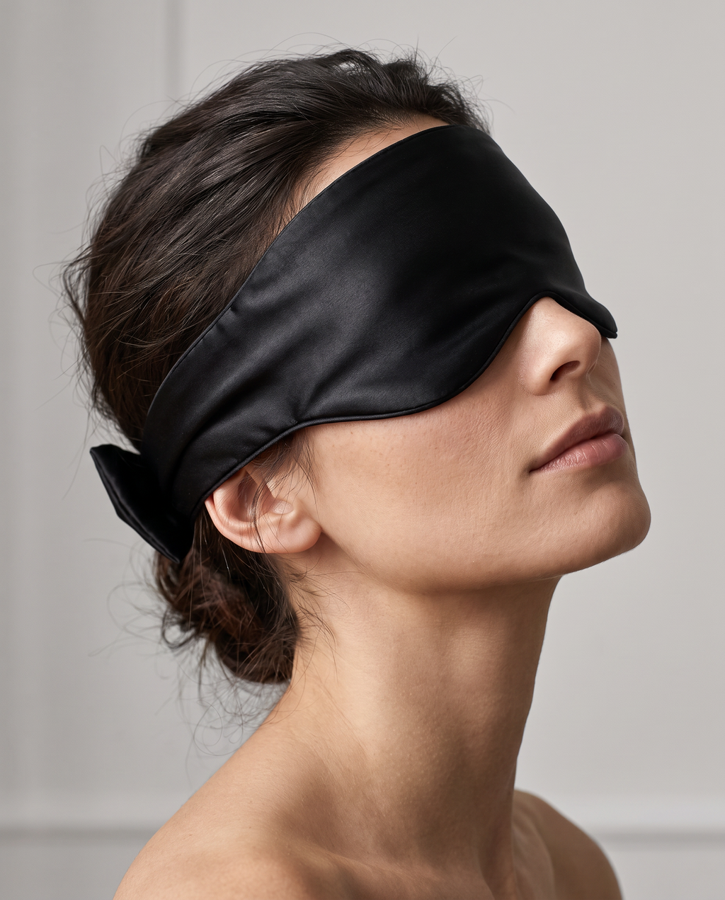 Editorial close-up of the Velmesta Silk Sleep Mask wraparound band