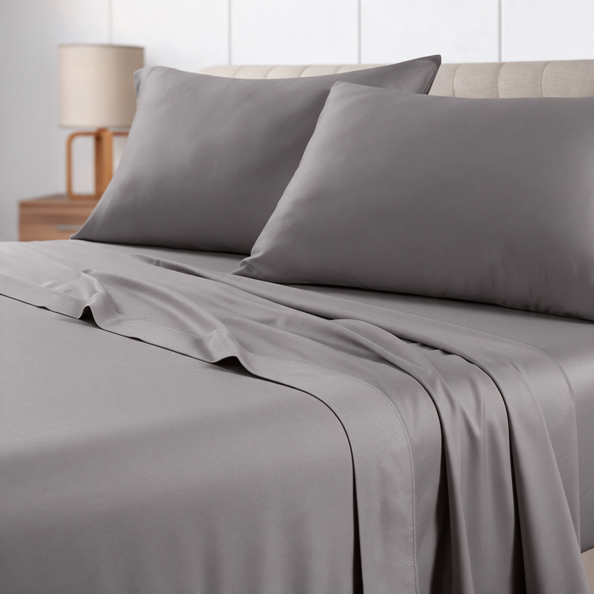Grey microfiber sheet set on a made bed