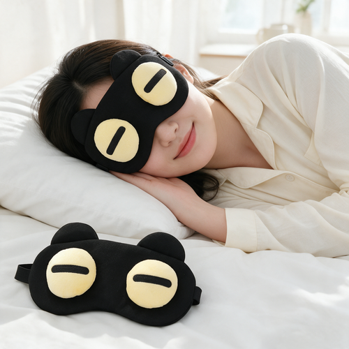 Black cartoon bear sleep mask worn in bed