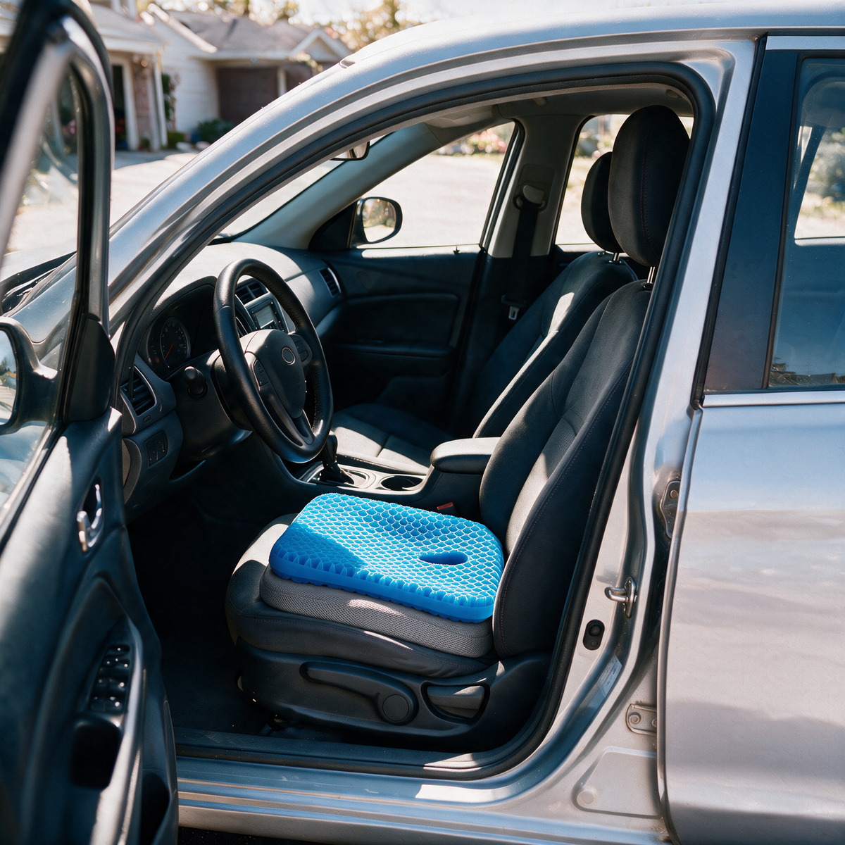 Velmesta honeycomb gel seat cushion with Gray washable cover on a car driver seat
