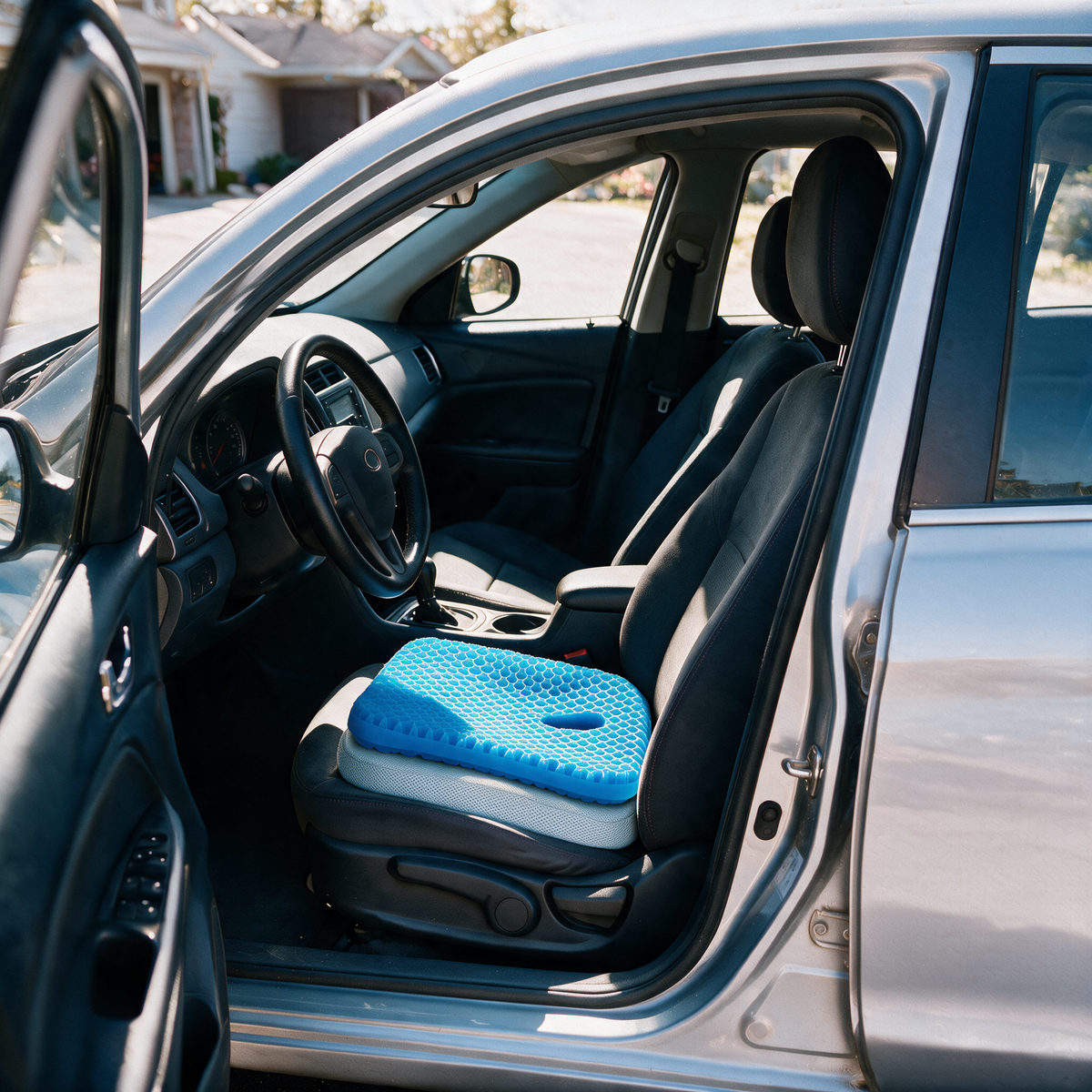 Velmesta honeycomb gel seat cushion with Blue washable cover on a car driver seat