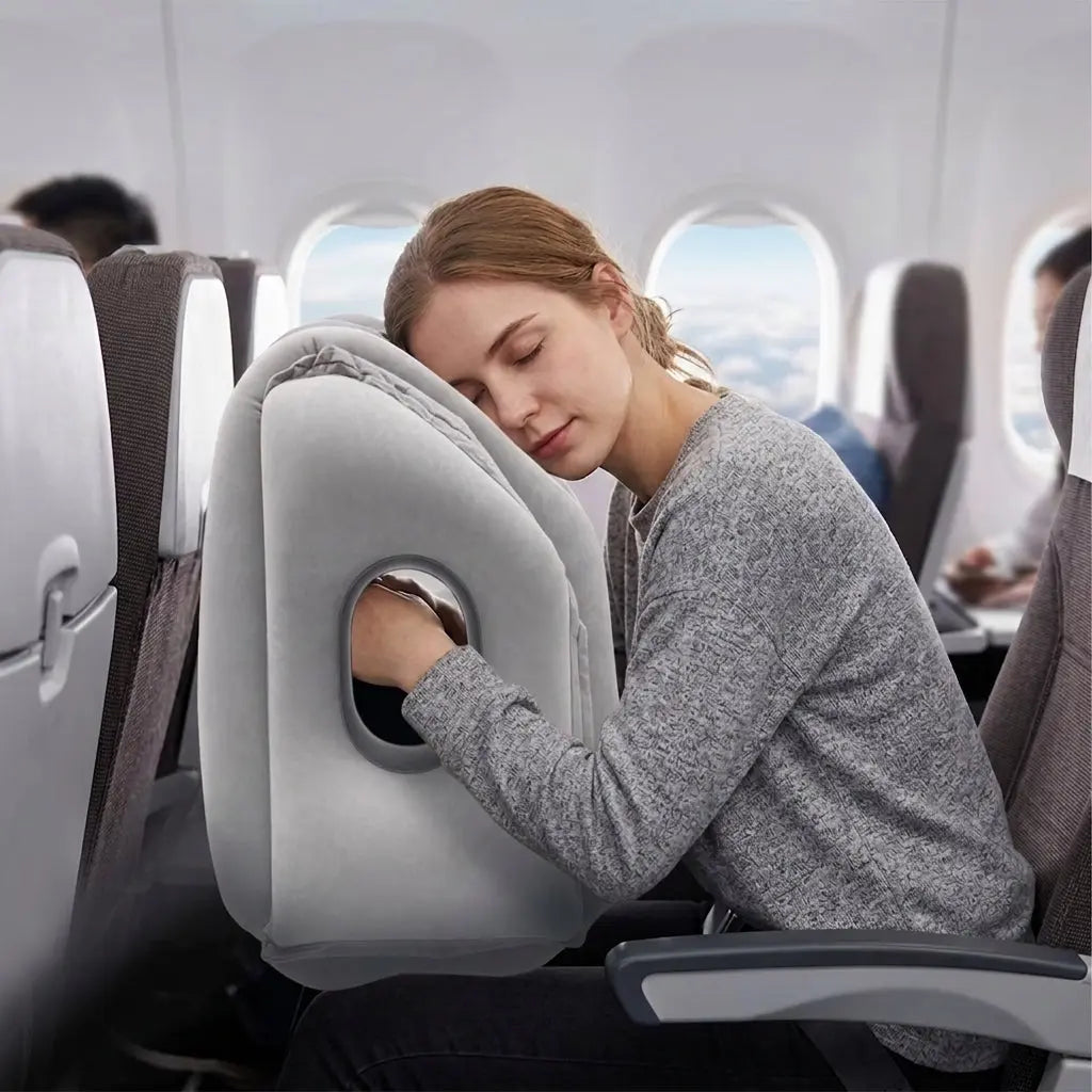 Velmesta Inflatable Travel Headrest in use on a plane seat